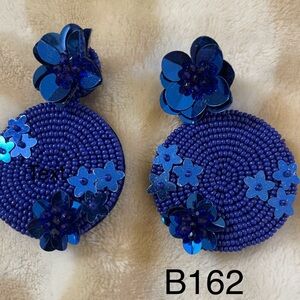 Royal Blue sea beaded earrings for pierced ears. Flower adorns the top of NWT